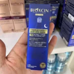 کرم دور چشم شب بیوکسین Age Reverse حاوی رتینول و کافئین ۱۵ میلی